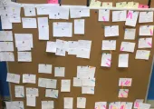 Figure 7:  Retrospective results. Blue tags - extra research is needed, pink tags - team member votes, what needs to be done on a first-priority basis